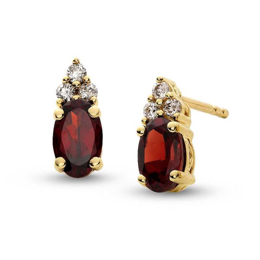 Earrings Zales | Oval Garnet And 1/10 Ct. T.W. Diamond Stud Earrings In 10K Gold