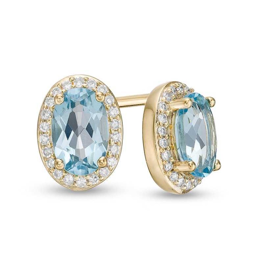 Earrings Zales | Oval Blue Topaz And 1/10 Ct. T.W. Diamond Frame Stud Earrings In 10K Gold