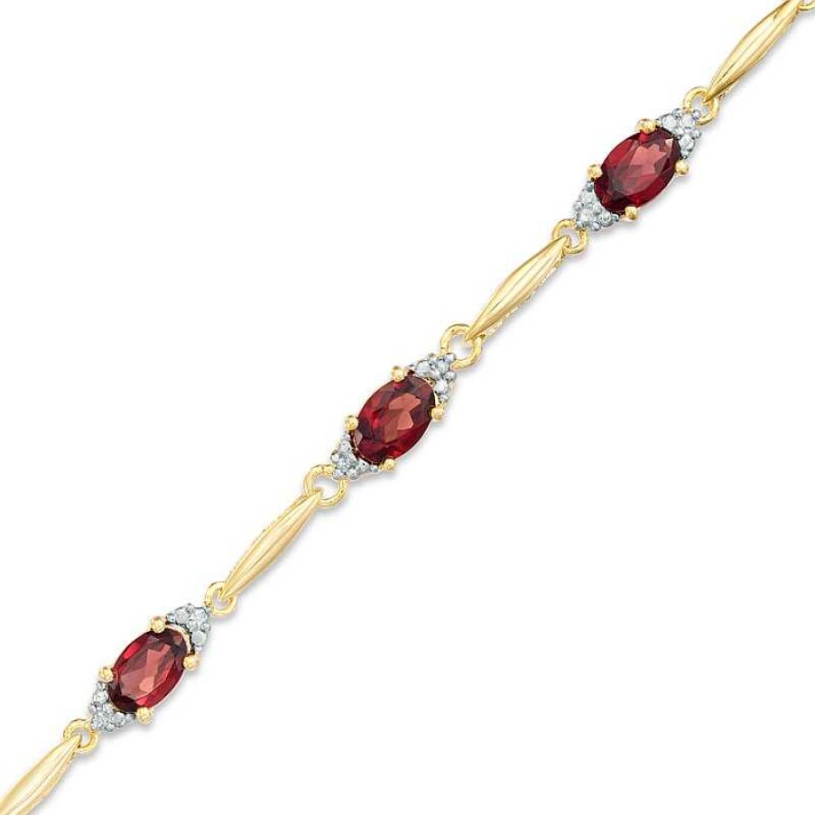 Bracelets Zales | Oval Garnet And Diamond Accent Bracelet In Sterling Silver And 10K Gold Plate - 7.25"