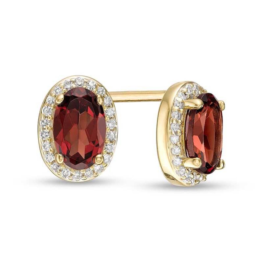 Earrings Zales | Oval Garnet And 1/10 Ct. T.W. Diamond Frame Stud Earrings In 10K Gold