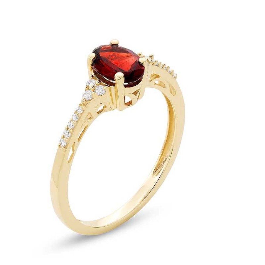 Rings Zales | Oval Garnet And 1/10 Ct. T.W. Diamond Ring In 10K Gold