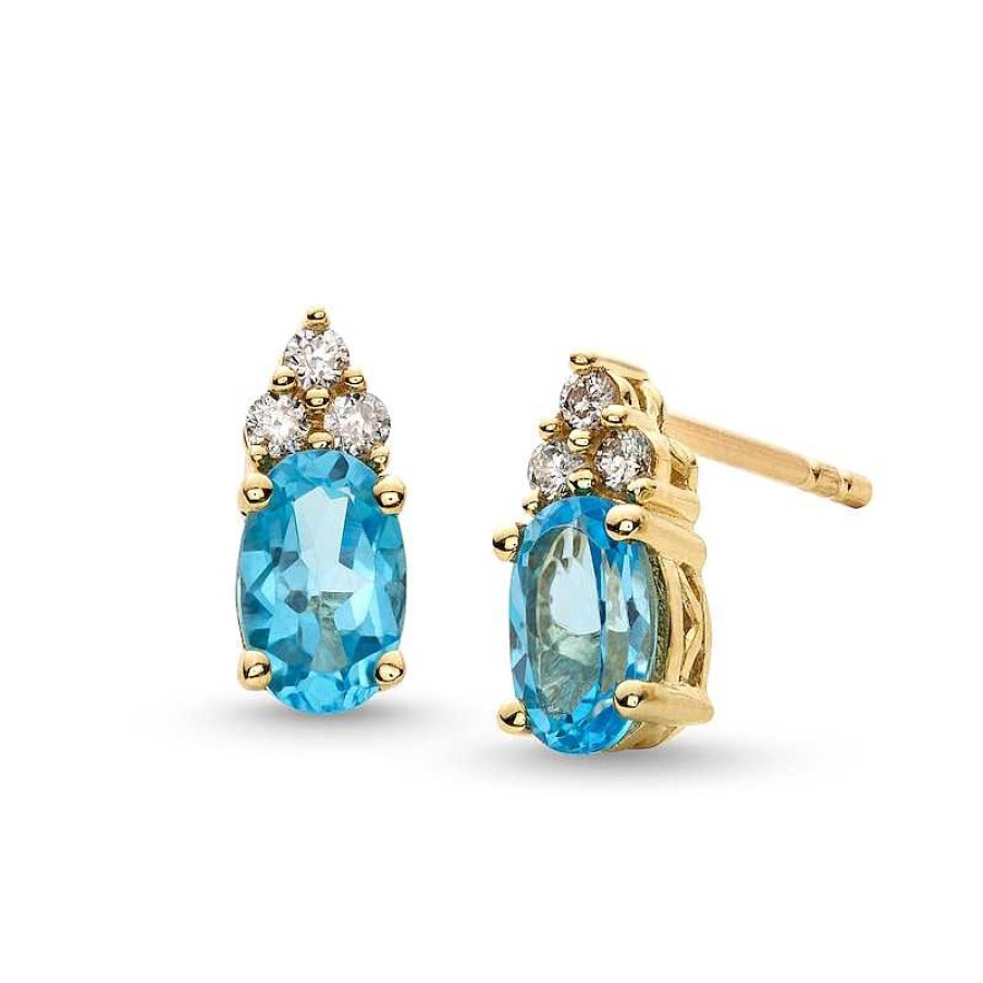 Earrings Zales | Oval Swiss Blue Topaz And 1/10 Ct. T.W. Diamond Stud Earrings In 10K Gold