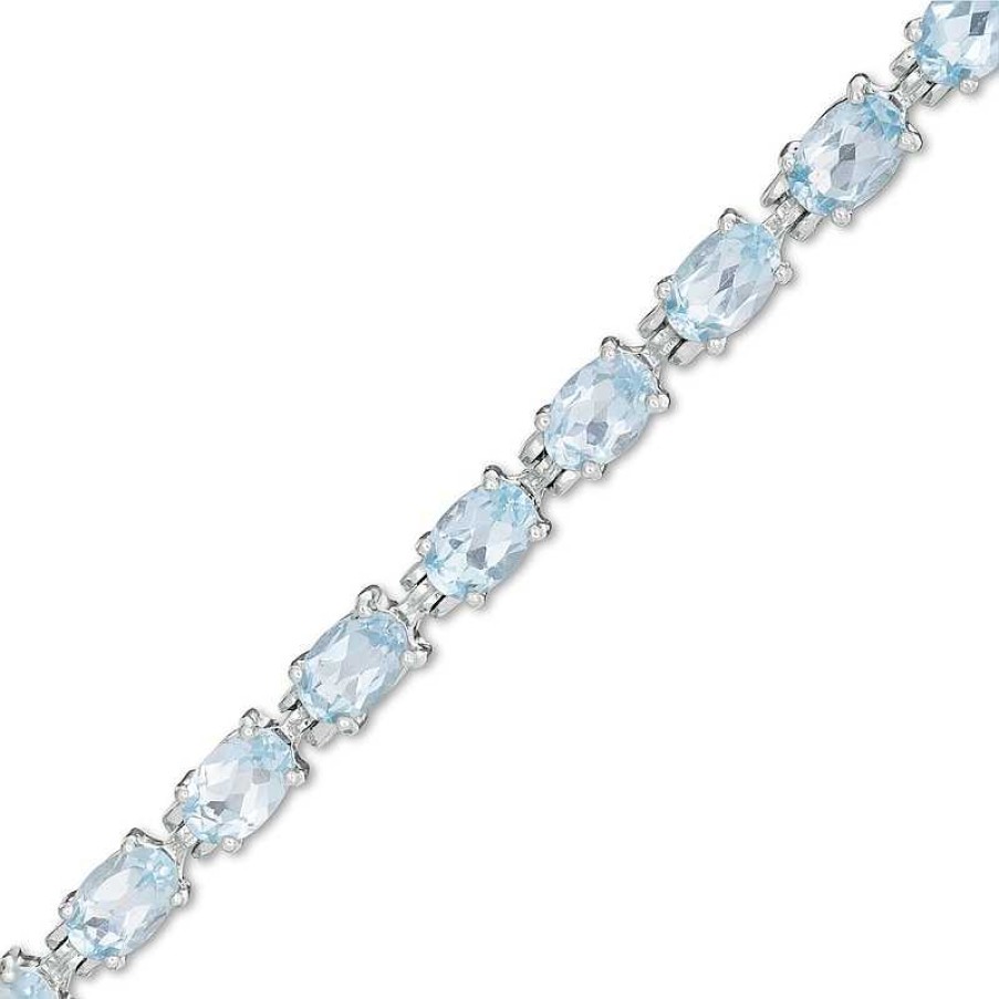 Bracelets Zales | Sideways Oval Blue Topaz Tennis Bracelet In Sterling Silver - 7.5"