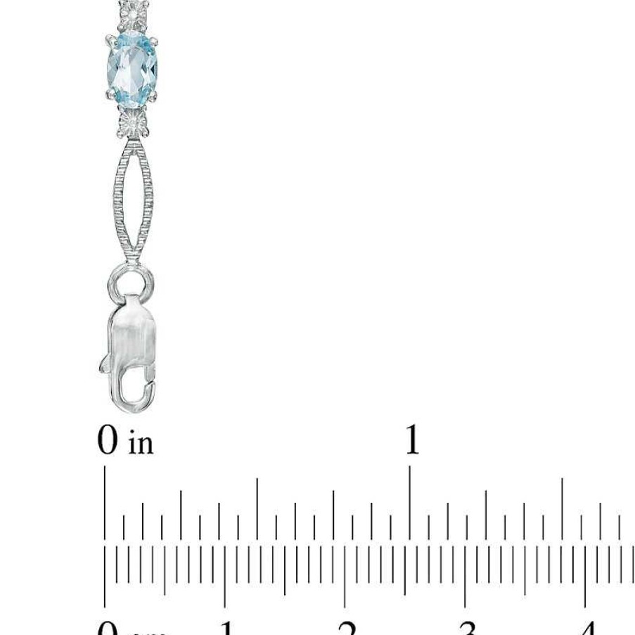 Bracelets Zales | Oval Blue Topaz And Diamond Accent Bracelet In Sterling Silver - 7.25"